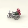White wooden hand-pushed food cart with flower POTS, camping stall cart, flatbed four-wheel storage rack Application Scenario